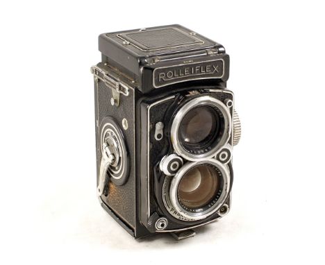 Rolleiflex 2.8C TLR Camera. #1280540 (condition 6F) Closes OK but locking pin missing from under film door, taking lens shows