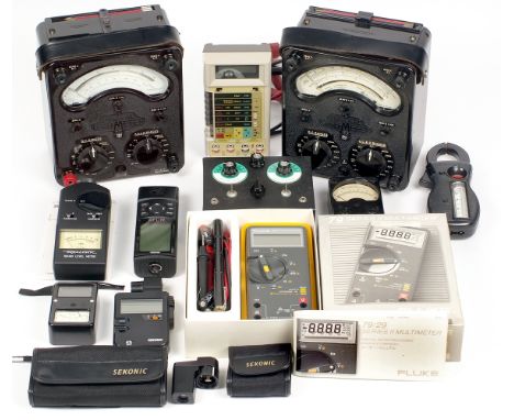 A Box of Exposure & Other Meters. To include two AVO meters in cases, a Fluke multimeter, Garmin GPS12, Sekonic Digi Lite F L