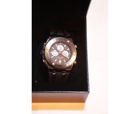 New boxed Michael Phillipe black dial wristwatch on a black rubber strap. P&amp;P Group 1 (£14+VAT for the first lot and £1+V