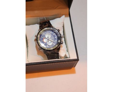 New boxed Barkers of Kensington black and blue dial wristwatch on a metal strap. P&amp;P Group 1 (£14+VAT for the first lot a