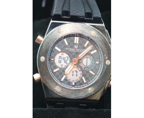 Boxed Michael Philippe mens wristwatch with black dial on black rubber strap. P&amp;P Group 1 (£14+VAT for the first lot and 