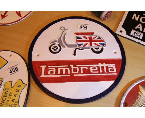 Cast iron Lambretta sign, D: 29 cm. P&amp;P Group 2 (£18+VAT for the first lot and £3+VAT for subsequent lots) 