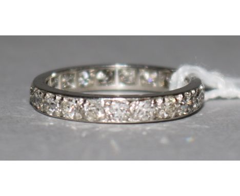 A platinum and diamond full eternity ring, with spare section, size J.