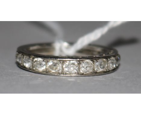 A platinum and diamond half eternity ring, size L.