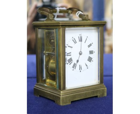A gilt brass carriage clock, late 19th/early 20th century, with 8-day movement and white-enamelled dial,