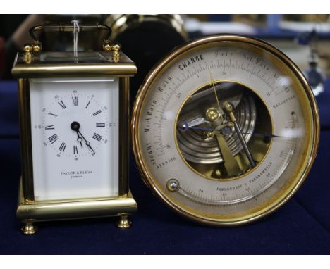 A French eight day carriage timepiece, retailed by Taylor & Bligh, and a brass framed aneroid barometer