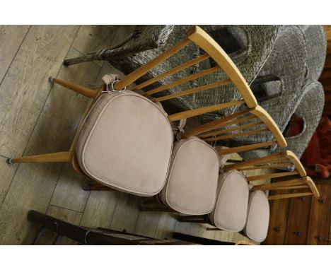 Four Ercol dining chairs (design no.391) with cushions