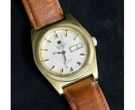 A gentleman's gold plated and steel Tissot PR 516 automatic wrist watch.