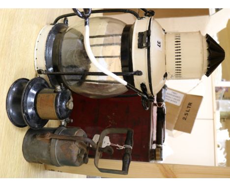 An early 20th century petrol canister, a klaxonet horn, a lantern and one other item