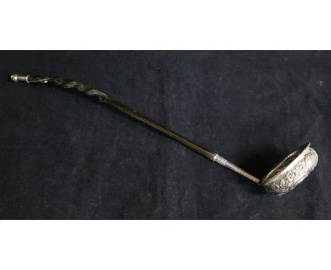 A George IV Scottish embossed silver toddy ladle with baleen handle by Peter Aitken I, Glasgow, 1826, 15.25in.