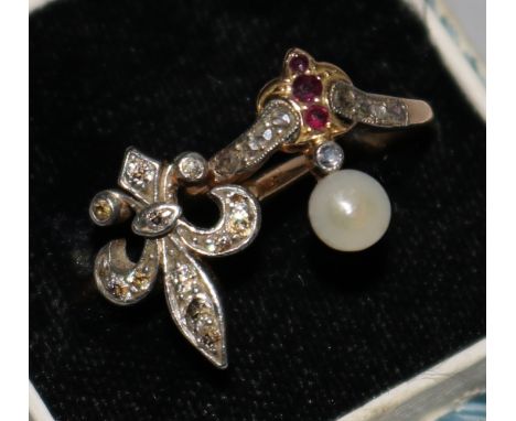 A diamond set " Fleur de Lys" ring and one other gem set ring.