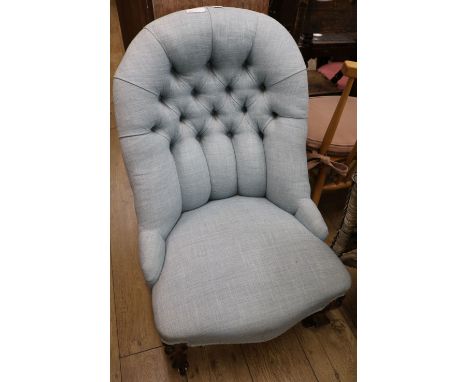 A Victorian rosewood button backed nursing chair