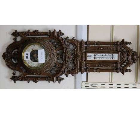 A mahogany aneroid barometer, 55cm.