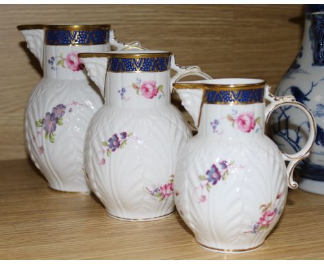 A set of three Coalport Caughley mask head jugs, graduated set, largest 17cm