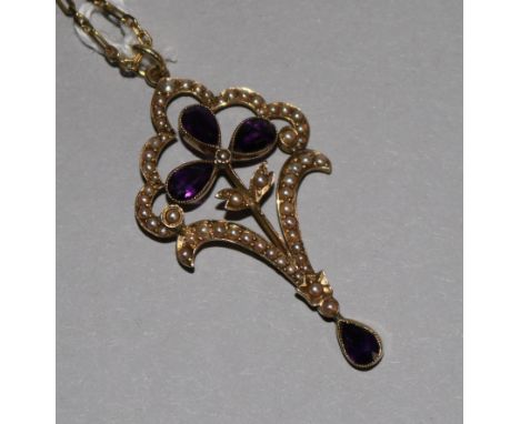 A 15ct gold, amethyst and seed pearl openwork pendant on 9ct gold chain, pendant 1.75in.