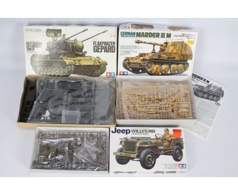 Tamiya - Three boxed 1:35 scale military vehicle plastic model kits. Lot consists of Tamiya #3599 Flakpanzer Gepard; #35255 M