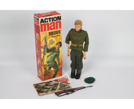 Palitoy Action Man - A boxed vintage Action Man Soldier with Gripping Hands. The blonde flock haired figure is marked  'Made 