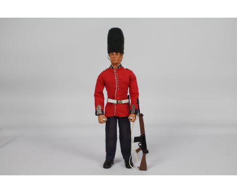 Palitoy, Action Man - A Palitoy 'Talking' Action Man figure in Grenadier Guard outfit . The eagle-eye, blond flock haired, ''