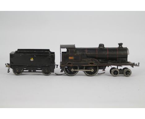 Bing - Bassett Lowke - An electric O gauge 4-4-0 loco named George The Fifth for spares or restoration, the 3 rail pickup has