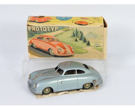 JNF (Germany) - A boxed JNF Prototyp tinplate clockwork Porsche, made in the 'US Zone of W.Germany' . The model, in pale blue