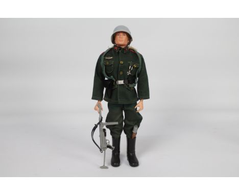Palitoy, Action Man - A Palitoy Action Man in German Stormtrooper outfit. The blonde painted  hard head figure with hard hand