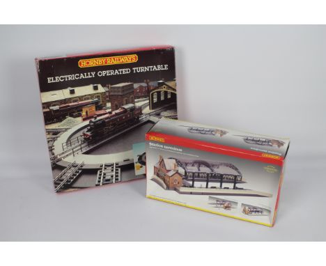Hornby - A boxed OO gauge Station Terminus # R8009 and a boxed electrically operated Turntable # R070. Both show light signs 