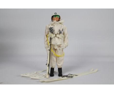 Palitoy, Action Man - A Palitoy black painted head Action Man figure in Ski Patrol / Mountain Troops outfit. The figure with 