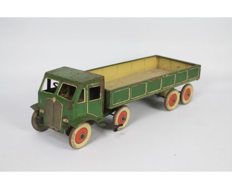 Mettoy - A large clockwork 8 wheel articulated lorry in green with cream lining and Dunlop Fort tyres. It measures 43 cm x 15