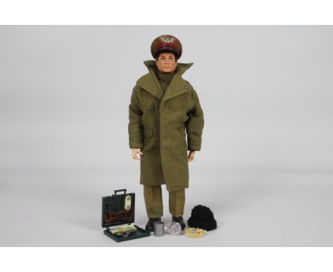 Palitoy, Action Man - A Palitoy Action Man figure in Colditz Escape Officer outfit. The dark brown flock haired figure with h