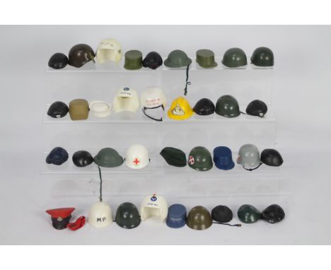 Palitoy, Action Man - A collection of approximately 36 Action Man hats and helmets. Lot includes Fireman's Helmet; German Sto