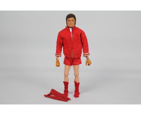 Palitoy, Action Man - A Palitoy Action Man Liverpool FC Footballer figure with sideburns. The dark brown flock haired, figure