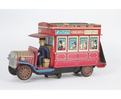 Modern Toys - A battery powered tinplate Type B London Bus model made by Modern Toys in Japan. It shows signs of age and use 