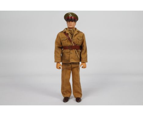 Palitoy, Action Man - A Palitoy Action Man in British Army Officer outfit. The blonde flock haired figure with gripping hands
