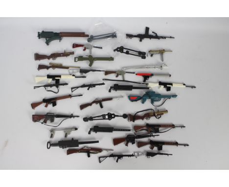 Palitoy, Action Man - An arsenal of Action Man guns and weapons. Lot includes, Sten gun,  Grease gun, SLR Arctic rifle, Bren 