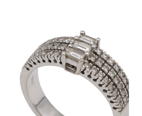 White metal diamond ring stamped 750, set with three baguette diamonds flanked by 6 rows of 8 diamonds, weight 8.9 grams, siz
