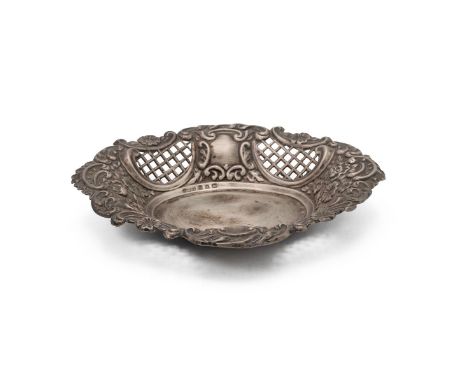A silver dish with embossed foliate decorations and pierced open panels, weight 60 grams.