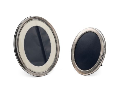 Two oval silver framed photograph frames, smallest 16.5cm high, tallest 20.02cm. Both hallmarked Sheffield 1983 &amp; 2000, m