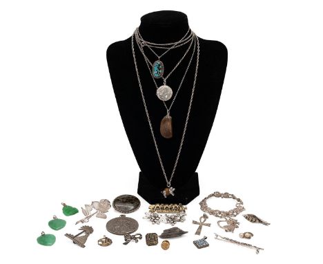 A good collection of silver and white metal jewellery, including brooches, pendants and other items.