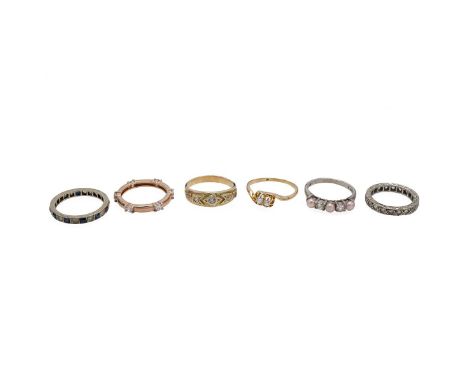 Six assorted rings, two 18ct gold tested diamond rings, one set with five diamonds and one set with two diamonds in a flower 