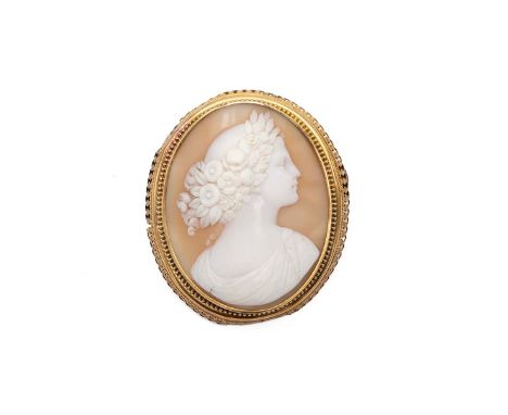 A 19th-century cameo brooch, the carved panel decorated with a portrait of a female, in a yellow metal mount, tested 18ct, 18