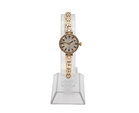 9ct gold lady's Cocktail wristwatch and 9ct strap. 30mm case, manual wind, silvered dial, baton hour markers and hands. Gross