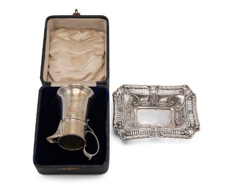 Silver jug with raised banding and loop handle in an associated leather box, London, 1911, makers mark worn. Along with a pie