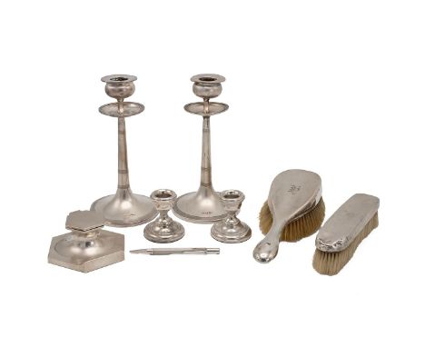A collection of hallmarked silver to include a pair of weighted silver candlesticks with drip trays (H 20cm); a pair of weigh