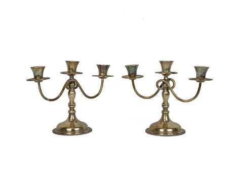 Pair of Mexican silver two branch candelabra with scrolled arms stamped 925 Sterling with gadroon decoration to the candle sc