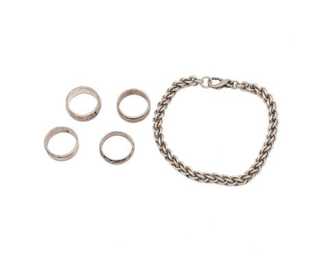 Four assorted silver rings &amp; a silver chain mail bracelet, total weight 81 grams.