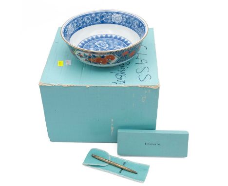 Tiffany: a sterling silver lady's ballpoint pen with branded cloth pouch and branded box; and a small Japanese style fruit bo