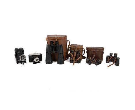 A collection of binoculars and cameras, including a leather-cased Hezzanith First World War era military example stamped 1916