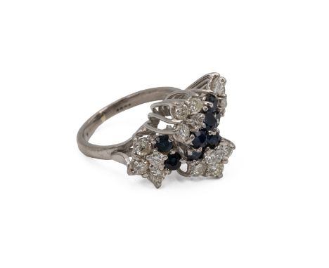 An 18ct white gold, sapphire and diamond cluster ring, the centre set with eight sapphires surrounded by 16 brilliant cut dia
