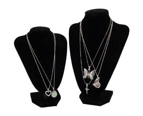 A collection of silver necklaces, including a Clogau love heart pendant and various others.