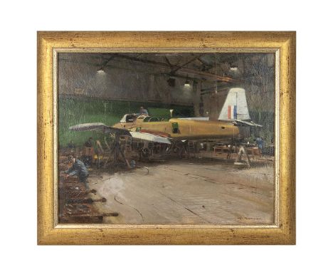 W Brown circa 1950 mechanics tending a military aircraft, a Hunting Percival Jet Provost, with tricolour to tail fin, in a ha